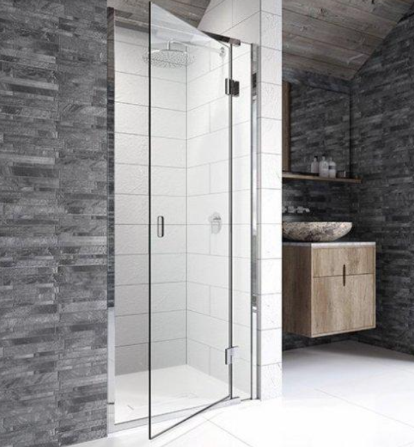 Hinged glass shower door with metal hinges in a modern bathroom